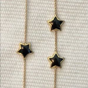 Long strand black star necklace
